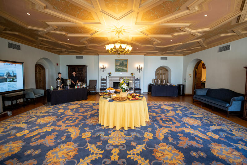 I-House Home Room I-House Home Room Reception set up with Barantique furnishings, large decorative fireplace, and balc