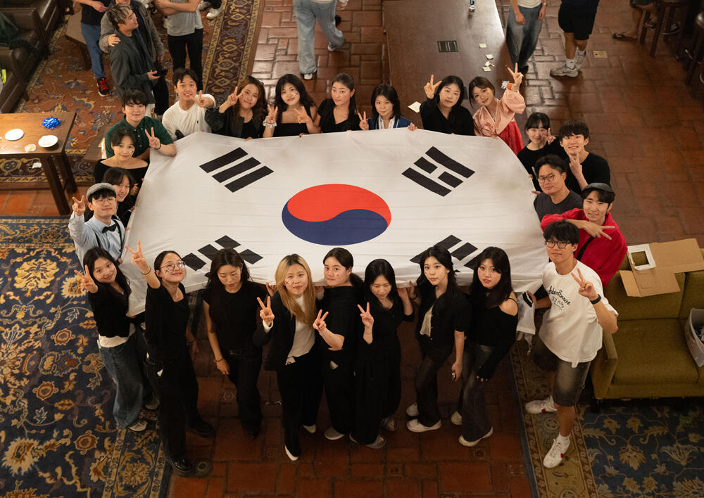 Residents holding South Korea Flag at the DIversiTEA & Coffee Hour