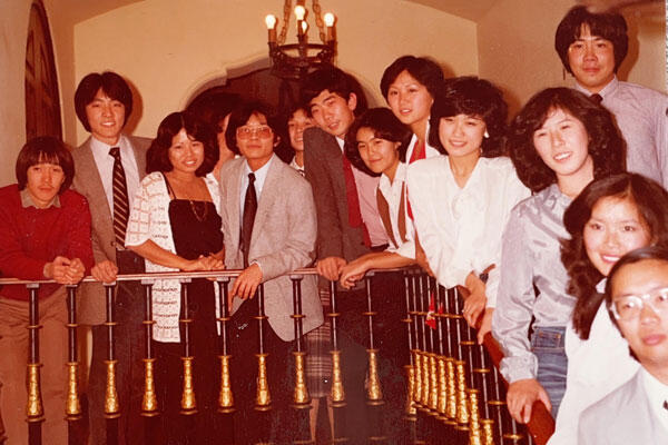 Residents on stairs in 1980