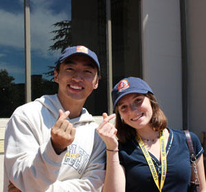 Leran Zhao and Erica Ottolini wearing I-House alumni hats