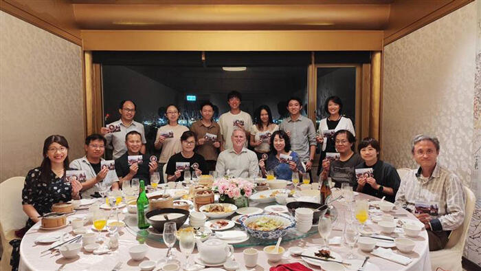 Shaun Carver with I-House alumni (holding I-House alumni stickers and postcards of I-House) at the Grand Hotel Taipei on June 1, 2024